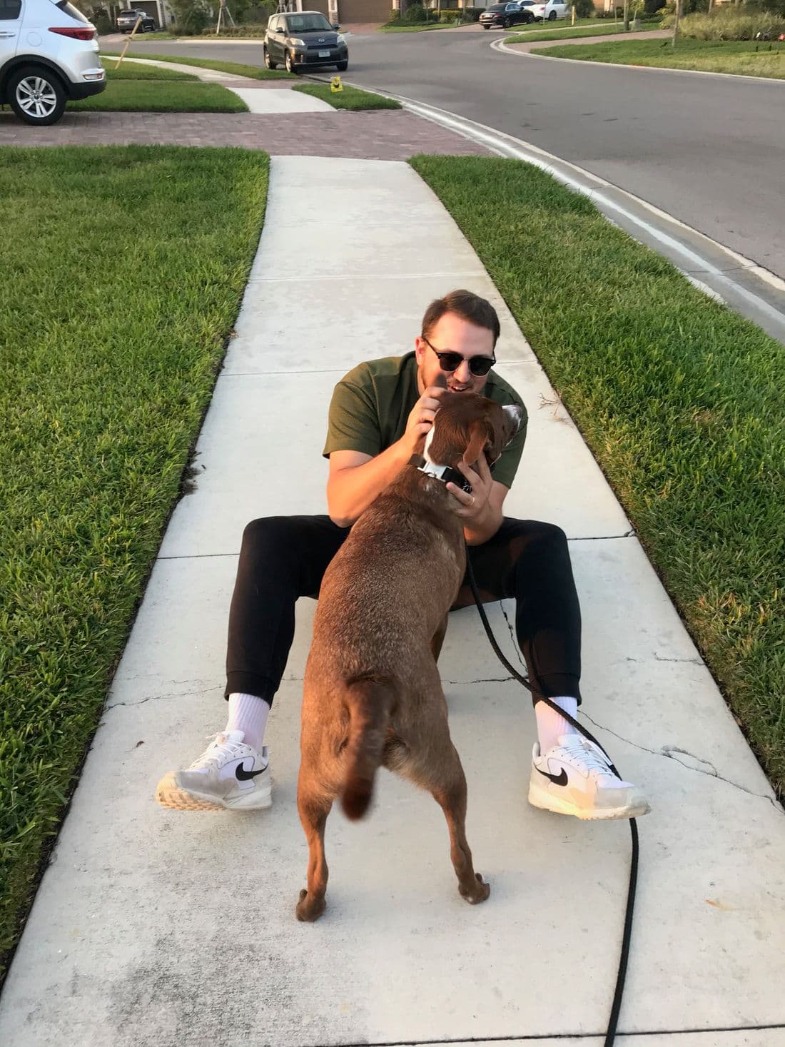 Samuel Tupy outside with his dog